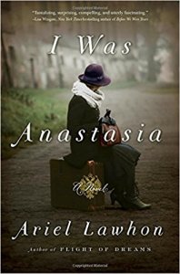 Book Cover Image of Ariel Lawhon's historical fiction novel titled I Was Anastasia. The image features a woman whose face is obscured by a hat in clothing from another decade perched delicately on top of a suitcase.